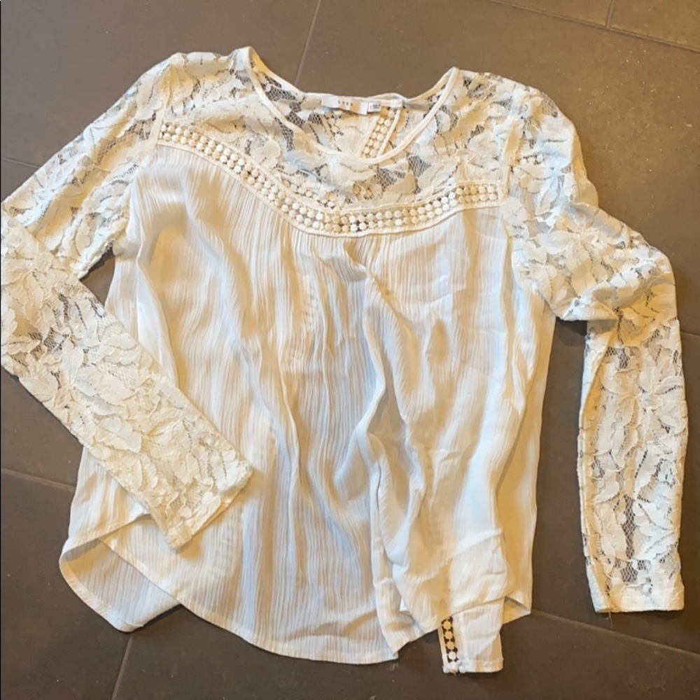 Lush blouse with lace detail and open back